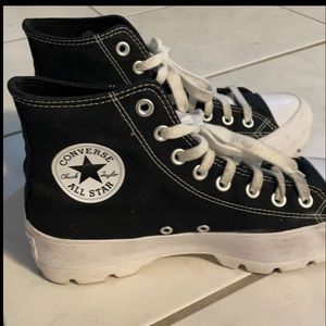 Blacks and white  hightop converses